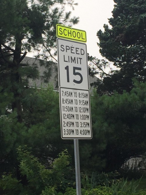 School speed limit sign with multiple times of enforcement